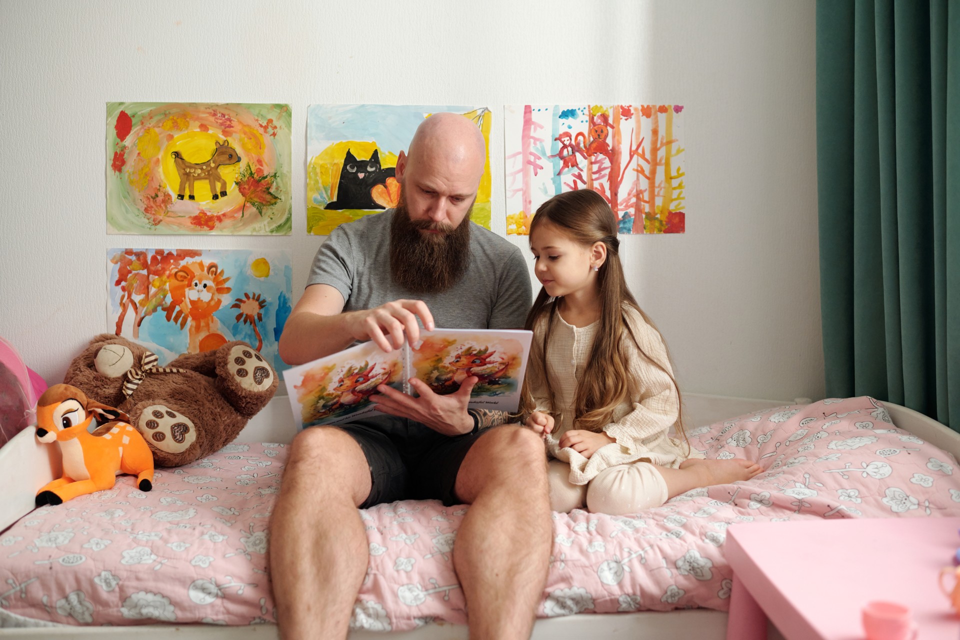 Father reading comics to daughter