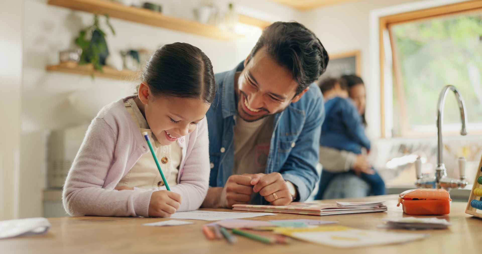 Writing, learning and family, father and child in kitchen for home education, language development and support. Helping, teaching and happy people, dad and girl or kid with school creativity on paper